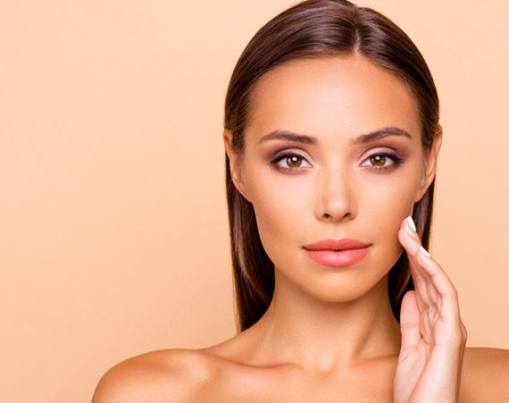 woman-touching-her-chin-showing-results-of-dermal-filler-injections